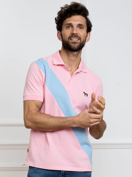 Man wearing pale pink 100% cotton polo shirt with sky blue sash detail and Newmarket 875 horse logo embroidered on the front.